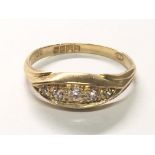 An 18carat yellow gold ring set with a row of five diamonds. Ring size O.