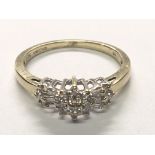 An 9 carat Gold ring set with a pattern of diamonds. Total carat weight 0.25 Ring size O.