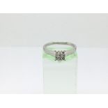 A 9ct white gold nine stone diamond ring, approx .24ct, approx 2.4g and approx size N.