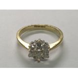 An 18carat Yellow gold ring set with a pattern of rose diamonds 0.50 cart. Ring size O.