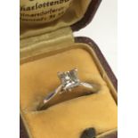 A platinum (950) and princess cut solitaire diamond. 1.09ct. (M).