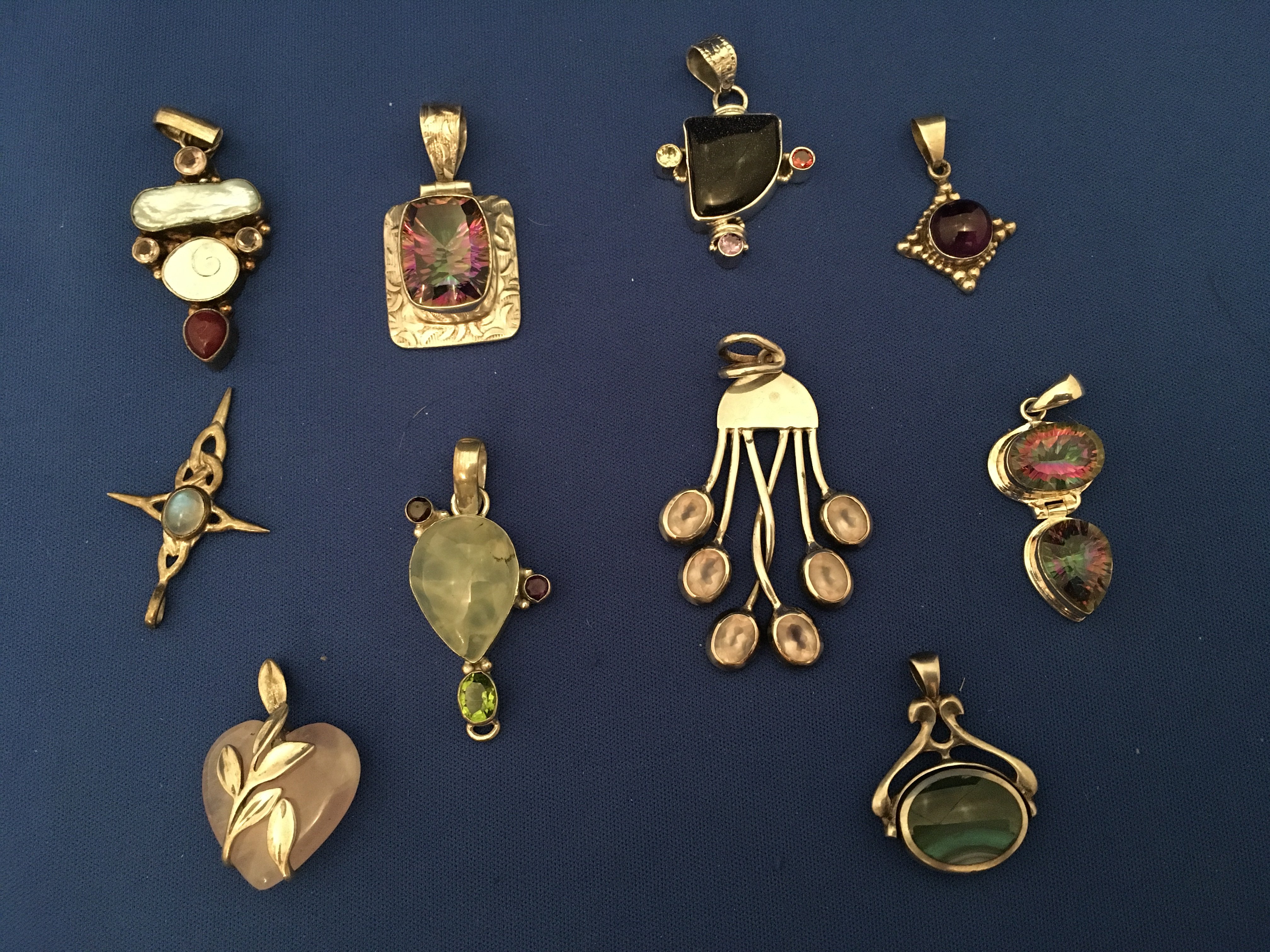 10 unusual silver and stone set pendants.