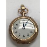 A 14ct Cased rose gold fob watch with Enamel decoration to back cover.