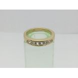 A 9ct gold half eternity seven stone diamond ring, approx 1/2ct, approx 5.7g and approx size M.