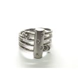 A modern design white gold ring set with diamonds 0.12 of carat total weight 6.5g ring size K-L