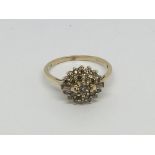 A 9ct gold diamond cluster ring set with champagne coloured diamonds, approx 1ct, approx 2.6g and