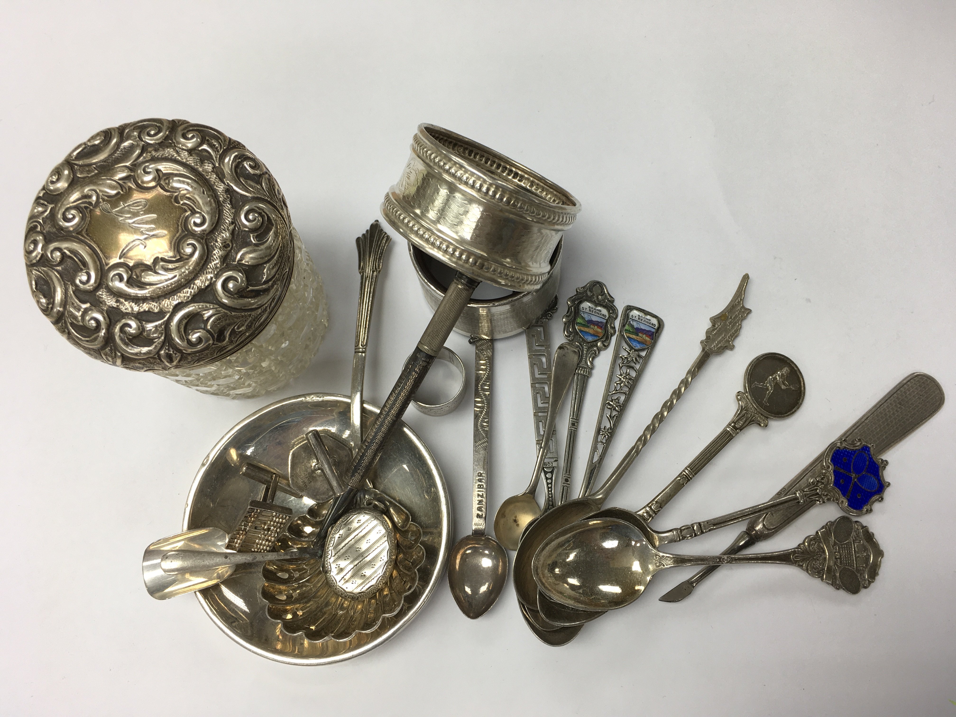 A small group of hallmarked silver items.
