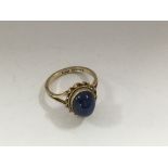 A 9 ct gold ring inset inset with lapis lazuli stone .
