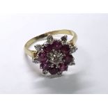 A well presented 18carat ruby and diamond cluster ring. Ring size P.