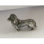 A silver figure in the form of a dachshund 31 grams .