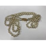 A 2 row pearl necklace with a 14ct gold clasp - NO RESERVE