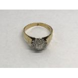 An 18ct gold diamond cluster ring, approx 4.6g and approx size P.