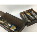 An Early 20th century cutlery box with two hinged sections and a cutlery tray with mixed cutlery -