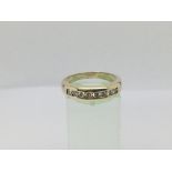 A 9ct gold half eternity ring set with 8 diamonds, approx .33ct, approx 4.7g and approx size P-Q.