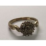 A 9carat gold diamond cluster ring. Ring Size M.
