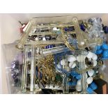 A large quantity of costume jewellery and display cabinet.