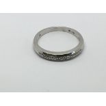 A 9ct white gold half eternity nine stone diamond ring, approx .10ct, approx 2.6g and approx size