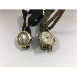 A 9ct gold ladies wrist watch and one other wrist watch.