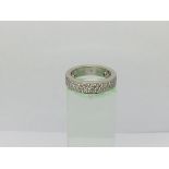 An 18ct white gold ring set with three rows of diamonds, approx 6.5g and approx size L.