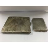 A silver cigarette case and a silver match case .