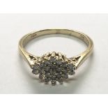 A 9carat gold ring set with a pattern of diamonds. ring size O.