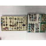 2 trays of mixed silver and silver gilt and white metal stone set rings. 90+.