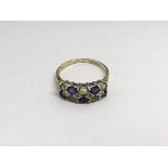 A ladies 9ct gold multi stone ring set with peridot, amethyst and small diamonds, approx 2.5g and