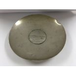 A silver dish marked 835 inset with a coin .132 grams 12.5 cm