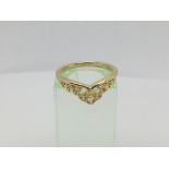 An 18ct gold dress ring set with baguette cut diamonds, approx 3.2g and approx size M.