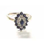 A 9carat gold ring set with a cluster pattern of sapphire and diamonds.ring size S.