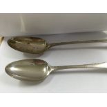 A Georgian silver serving spoon and a Georgian silver table spoon