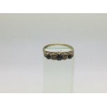 A 9ct gold ring set with sapphires and diamonds, approx 1.9g and approx size S.