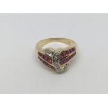 An 18ct gold ruby and diamond dress ring, approx 5.4g and approx size N.