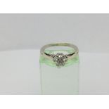 A 9ct white gold solitaire diamond ring, flaws to diamond, approx 2.6g and approx size N-O.
