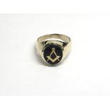 A 9ct gold gents Masonic ring set with a jet stone, approx 8.7g and approx size U-V.
