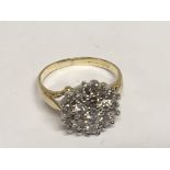 A 9ct gold diamond cluster ring set with brilliant cut diamonds. Ring size F.