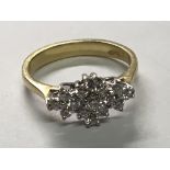 An 18carat gold ring set with a pattern of Brilliant cut diamonds.Ring Size K.