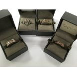 4 boxed Clogau, Welsh silver and gold rings.