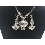 A silver .925 necklace and earrings suite with niello design