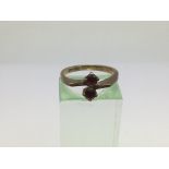 A 9ct gold set with two red stones, approx 2.5g and approx size M.