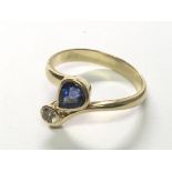 An 18carat Gold Ceylon Sapphire and diamond ring. Ring size M.