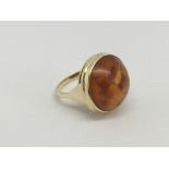 A 14ct gold ring set with cabochon amber, approx 8g and approx size P-Q.