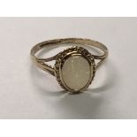 A 9carat gold ring set with an opal. Ring size J.