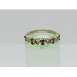 A 9ct gold ring set with ten small sapphires and four diamonds, approx 1.8g and approx size O.