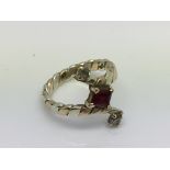 A 9ct ruby and diamond set 2 tone gold ring. Approx 3.5. (K).