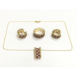 A 14ct gold and diamond jewellery set comprising a necklace and pendant, ring and a pair of