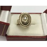 A heavy 9ct gold and diamond set ring,