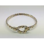 A 9ct gold and diamond set 2 tone woven design bracelet. approx 18.3g