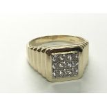 A Gents 9carat gold ring set with a pattern of CZ stones weight 7.4g ring size Y.