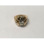 A gold ring of Victorian design inset with a singl